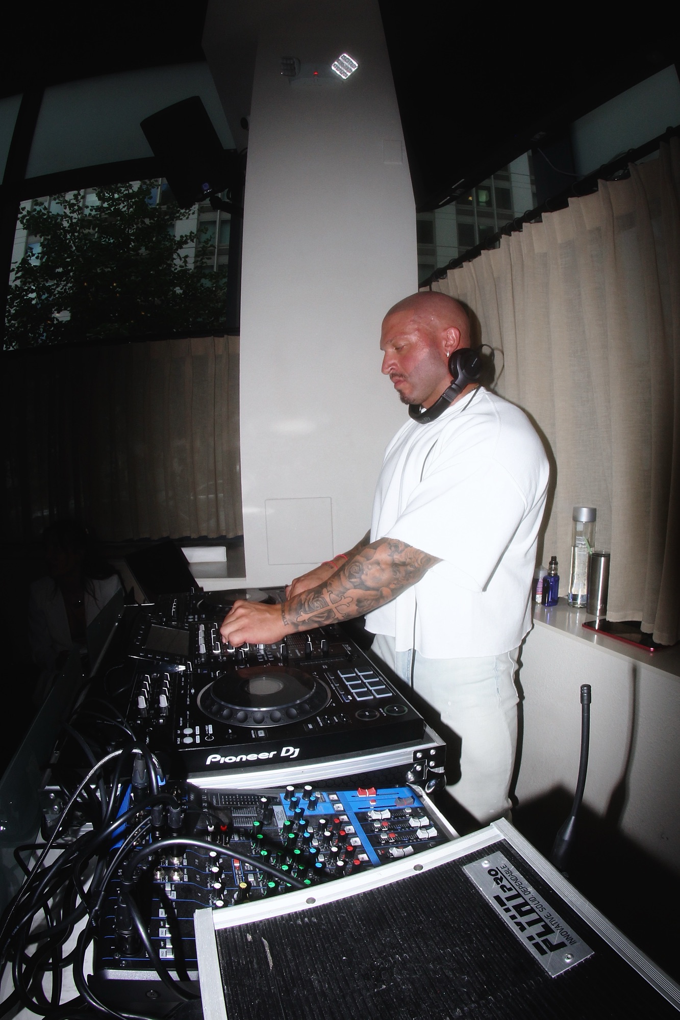 The DJ at the decks during an IKOS DJ night